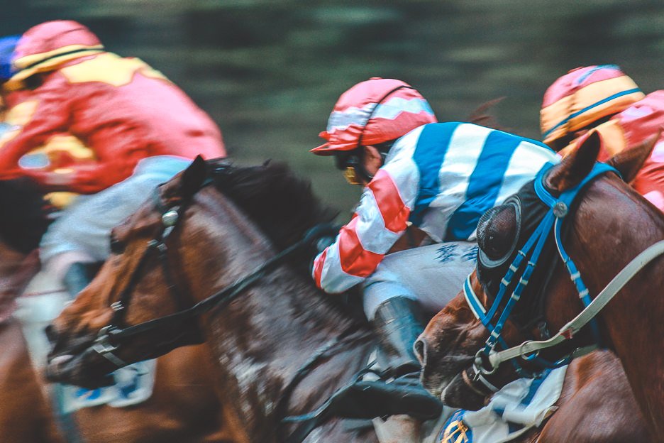 How To Spend 4 Days In Hong Kong 10 L Horse racing jockeys at Happy Valley racecourse, Hong Kong