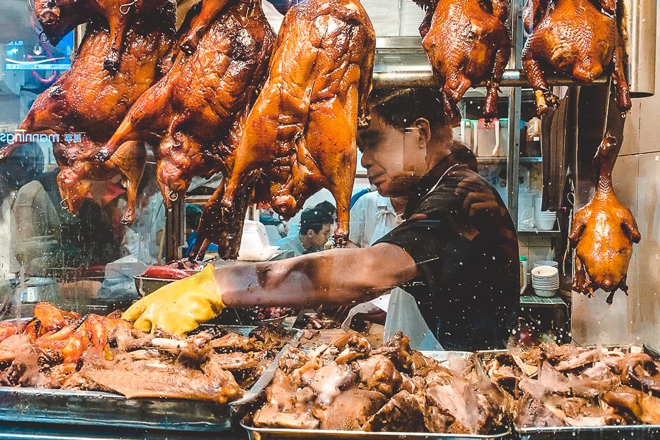 How To Spend 4 Days In Hong Kong 20 L A chef preparing meat in a Cantonese restaurant, Hong Kong