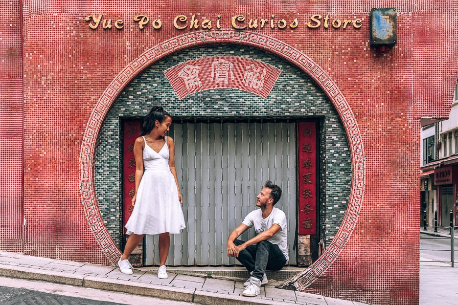 How To Spend 4 Days In Hong Kong 2 L a couple pose in the circular archway of Yue Po Chai Curios Store, Hong Kong