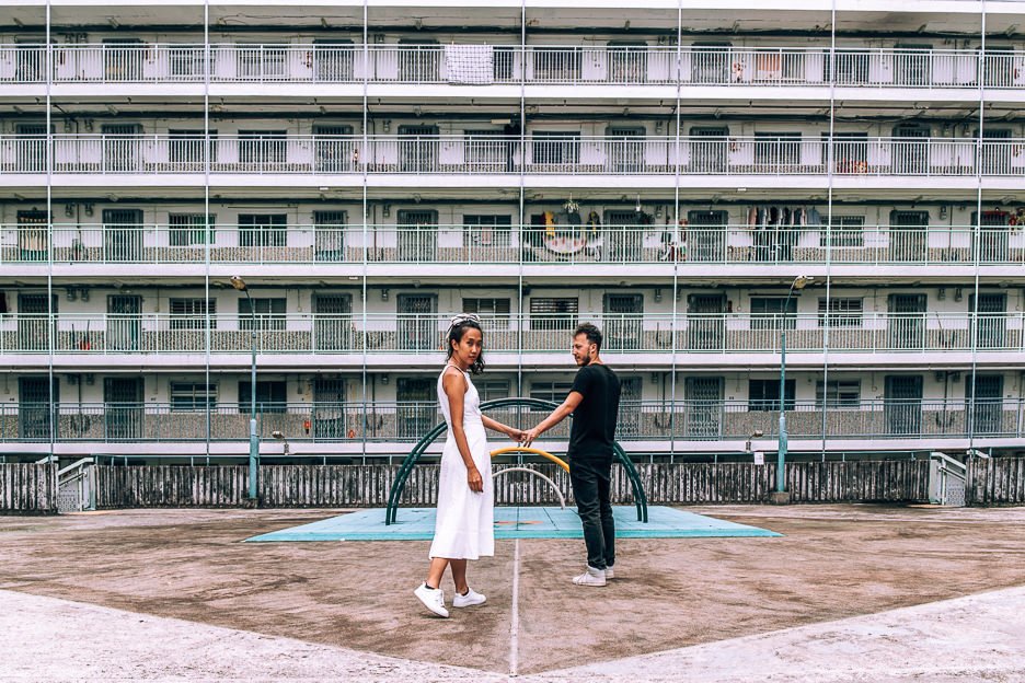 How To Spend 4 Days In Hong Kong 4 L 4 day Hong Kong Itinerary - a couple pose in the playground of Nam Shan Estate