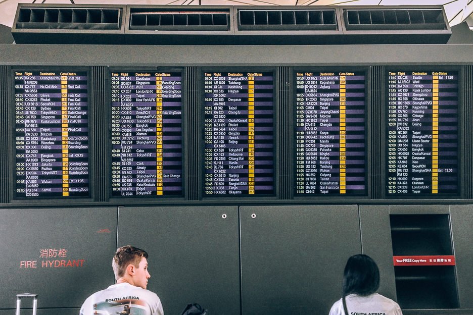 Travel Planning Resources | Looking at the departures board at an airport