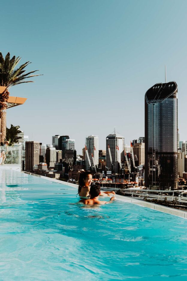 Rooftop infinity pool swims with view of Brisbane City at Emporium Hotel, South Bank