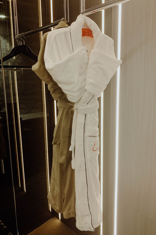 Plush cotton robes hanging in the King River City Suite, Emporium Hotel South Bank