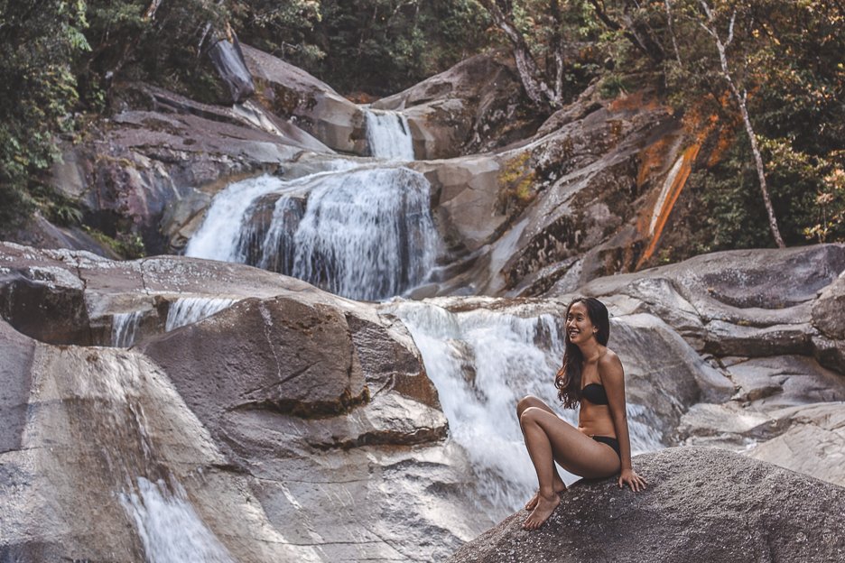 Sitting on a boulder at Josephine Falls