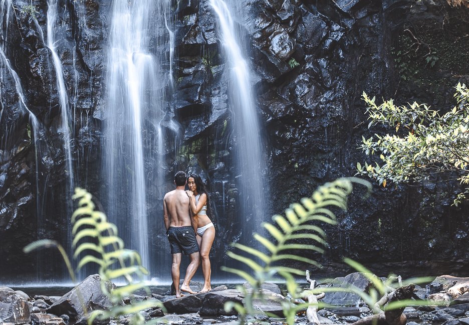 A couple post at the bottom of Ellinjaa Falls, Queensland