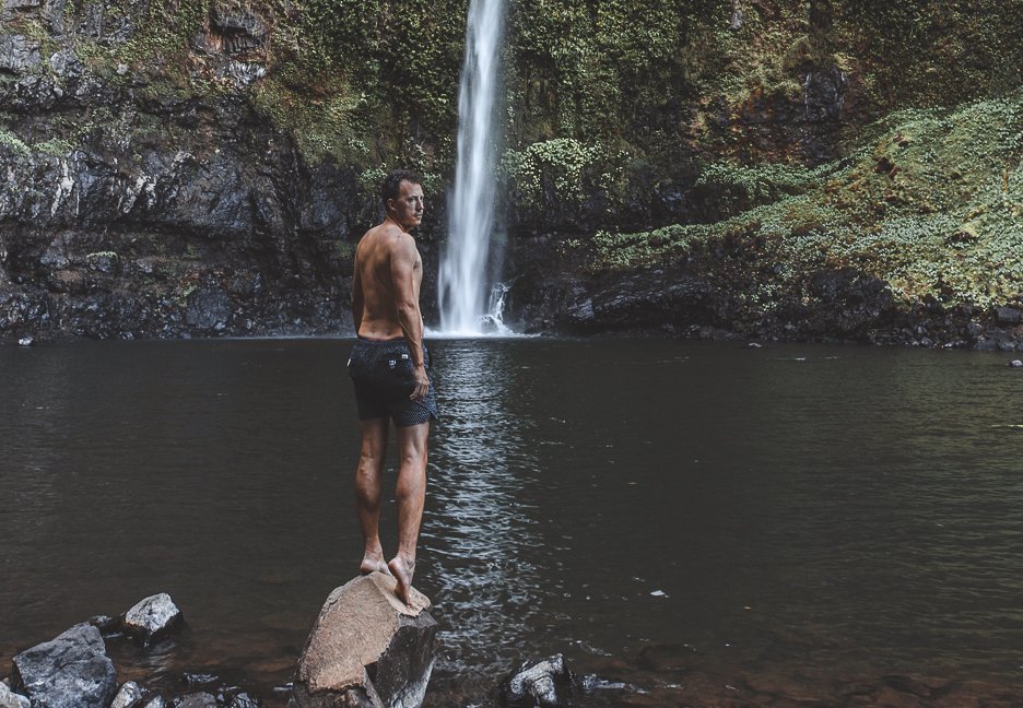 Standing at the edge of the swimming hole, Nandroya Falls