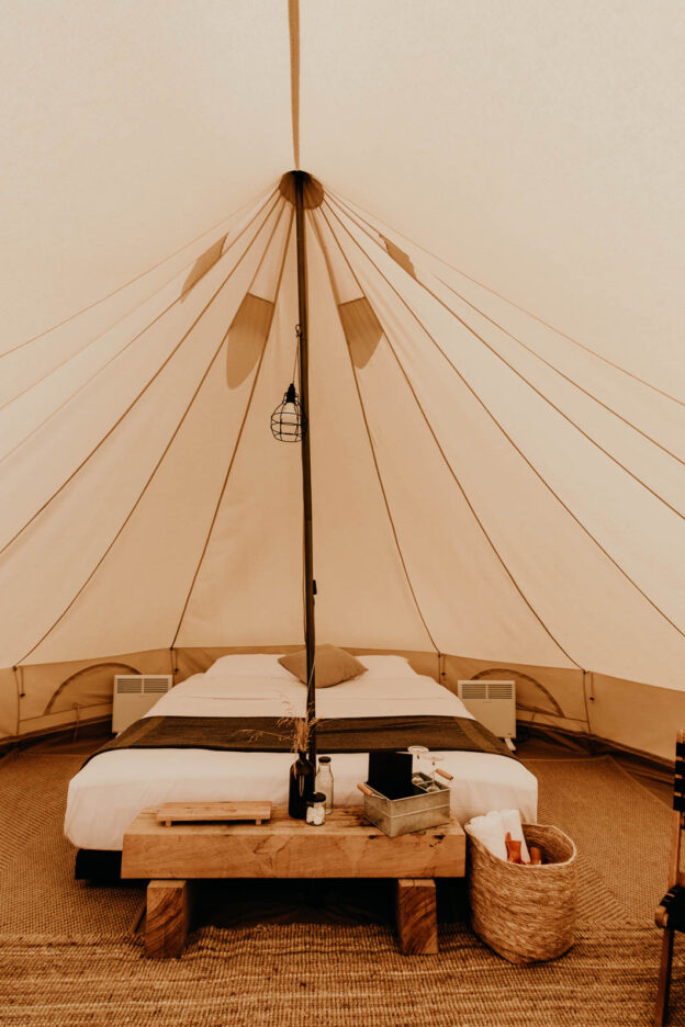Each glamping tent at Bay of Fires Bush Retreat features a king bed with electric blanket